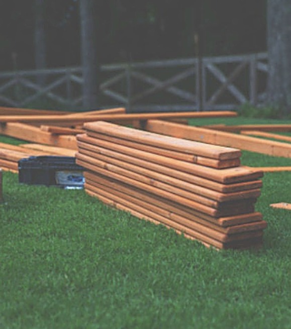 Cedar playset lumber staged for installation